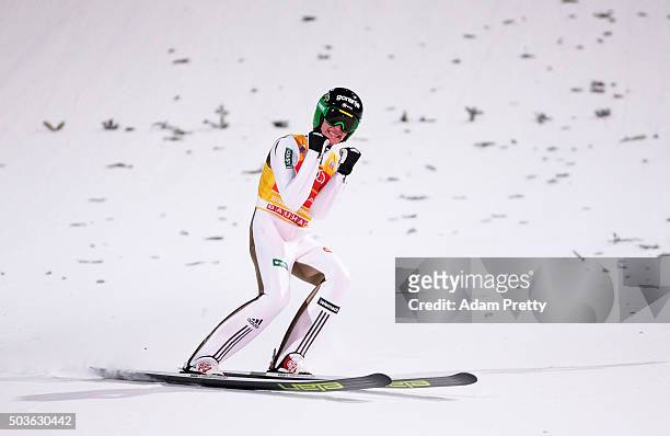 Peter Prevc of Slovenia celebrates victory and overall victory after landing his final competition jump on day 2 of the 64th Four Hills Tournament in...