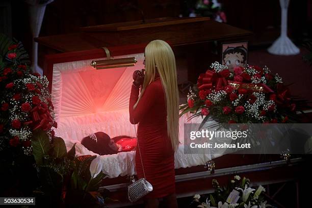 LaTisha Jones stands over her mother Bettie Jones during her funeral at New Mount Pilgrim Missionary Baptist Church January 6, 2016 in Chicago,...