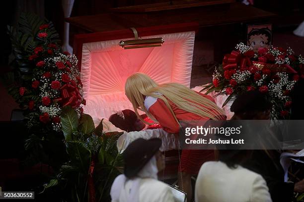 LaTisha Jones kisses her mother Bettie Jones during her funeral at New Mount Pilgrim Missionary Baptist Church January 6, 2016 in Chicago, Illinois....