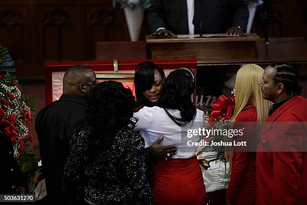Latoya Jones hugs her sister LaTonya Jones during the funeral for their mother Bettie Jones at New Mount Pilgrim Missionary Baptist Church January 6,...