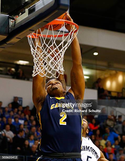 Jermaine Crumpton of the Canisius Golden Griffins dunks against the Monmouth Hawks defends during the first half of a college basketball game at the...