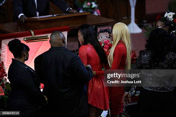 LaTonya Jones and LaTisha Jones stand over their mother Bettie Jones during her funeral at New Mount Pilgrim Missionary Baptist Church January 6,...