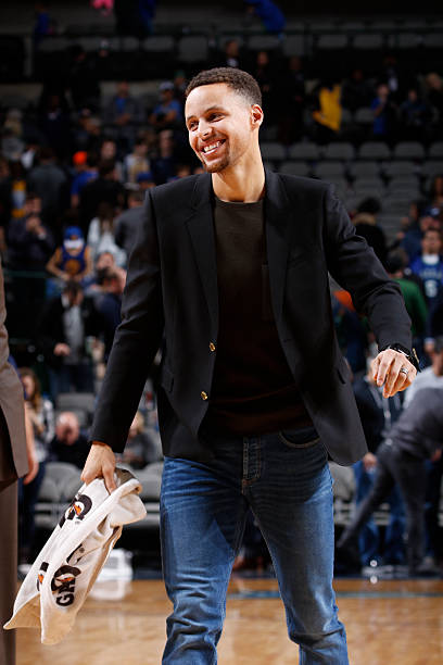 Stephen Curry of the Golden State Warriors walks on the court before the game against Dallas Maverick on December 30, 2015 at the American Airlines...
