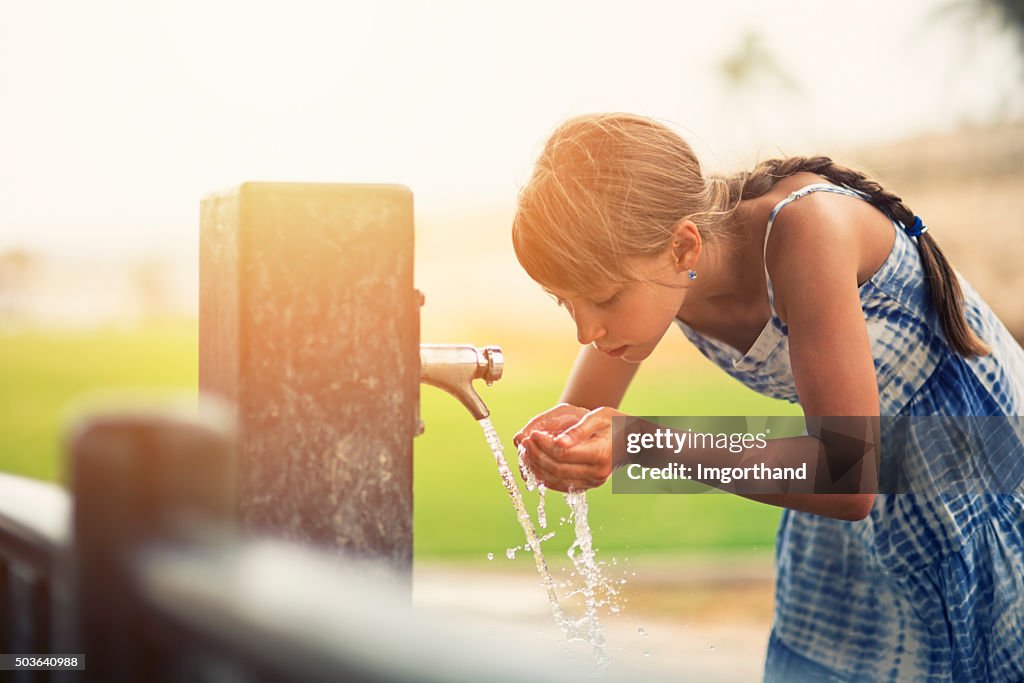 Little girl drinking water