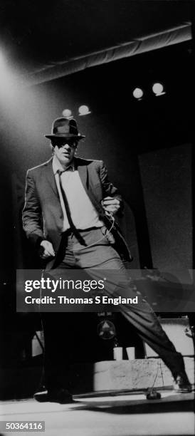 Actor Dan Aykroyd performing as one of the Blues Brothers.