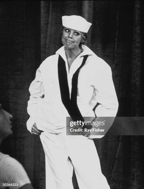 Actress Betsy Palmer wearing sailor outfit in role of Nellie Forbush in a scene from the stage musical South Pacific.