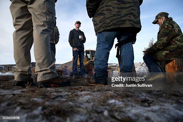 Members of an anti-government militia gather around a campfire oustide of the Malheur National Wildlife Refuge Headquarters on January 6, 2016 near...