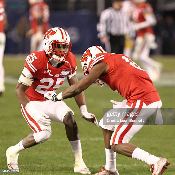 Derrick Tindal and Sojourn Shelton of the Wisconsin Badgers celebrate after interception against the USC Trojans during the National University...