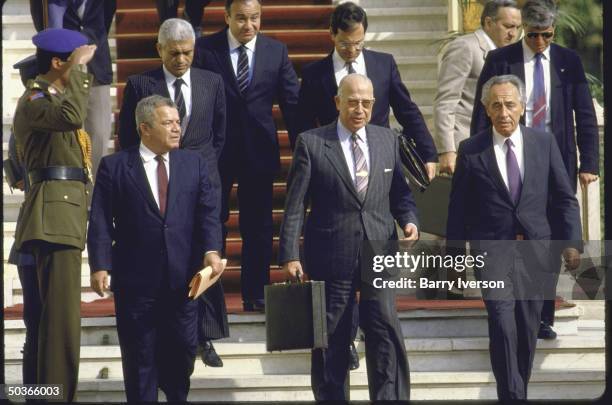 Israeli Foreign Minister Shimon Peres and Egyptian Foreign Minister Ahmed Esmat Abdel Meguid speaking during a press conference.