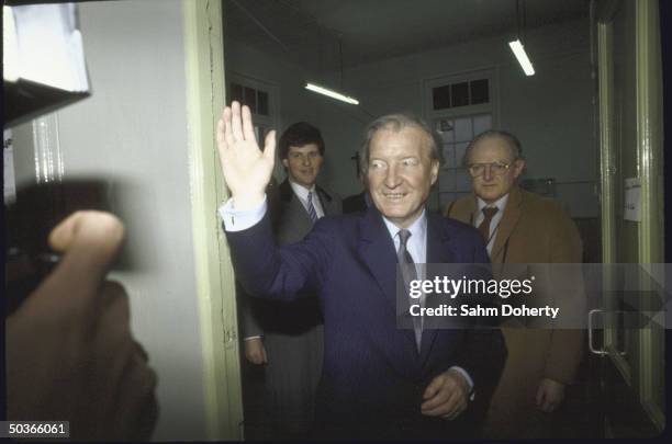 Irish Fianna Fail Party Ldr./ PM Cand. Charles Haughey , waving during the election vote count.