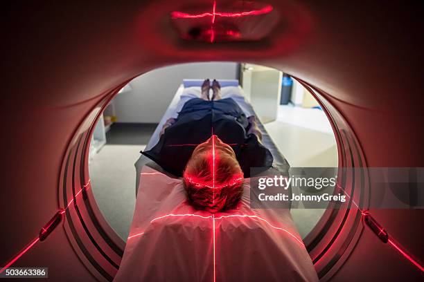 patient lying inside a medical scanner in hospital - tomografi bildbanksfoton och bilder