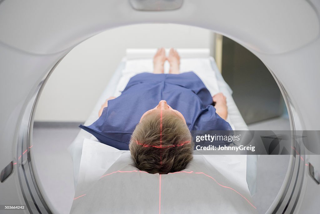 Patient receiving a CAT scan in hospital