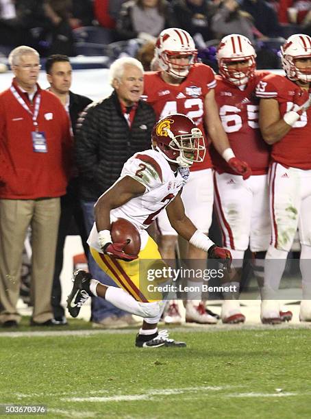 Adoree' Jackson of the USC Trojans carries the ball against the Wisconsin Badgers during the National University Holiday Bowl at Qualcomm Stadium on...