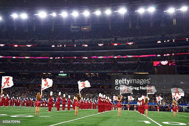 Cotton Bowl: Rear view of Alabama cheerleaders on field before game vs Michigan State during College Football Playoff Semifinal at AT&T Stadium....