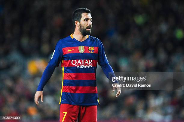 Arda Turan of FC Barcelona looks on during the Copa del Rey Round of 16 first leg match between FC Barcelona and RCD Espanyol at Camp Nou on January...