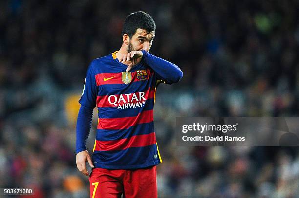 Arda Turan of FC Barcelona looks on during the Copa del Rey Round of 16 first leg match between FC Barcelona and RCD Espanyol at Camp Nou on January...