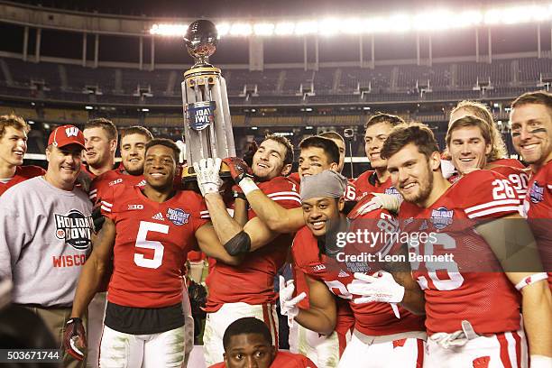 The Wisconsin Badgers celebrate their 23-21 win over the USC Trojans during the National University Holiday Bowl at Qualcomm Stadium on December 30,...