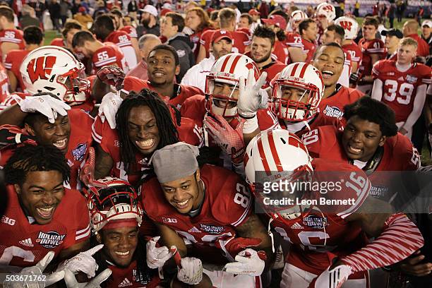 The Wisconsin Badgers celebrate their 23-21 win over the USC Trojans during the National University Holiday Bowl at Qualcomm Stadium on December 30,...