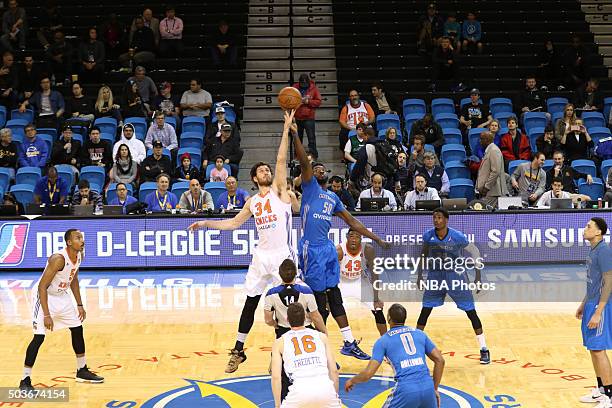 Jordan Bachynski of the Westchester Knicks jumps for the ball at tip off against Micheal Eric of the Texas Legends during an NBA D-League game on...