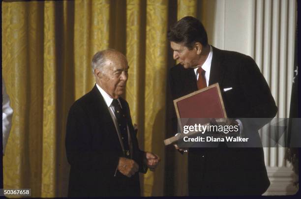 Art Patron Seymour Knox , accepting the National Medal of Arts from President Ronald W. Reagan.