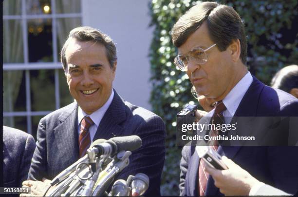 Representative Chester T. Lott with Senator Robert J. Dole speaking to press after meeting with President Ronald W. Reagan.