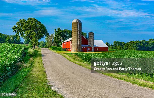 midwest farm with country road and red barn (p) - barn stock pictures, royalty-free photos & images