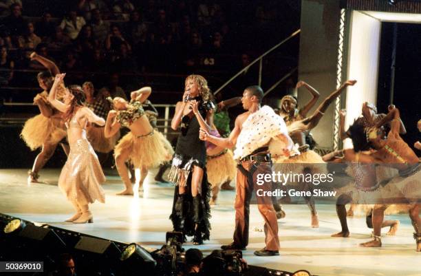 Whitney Houston and Usher performing at Michael Jackson's 30th anniversary concert.