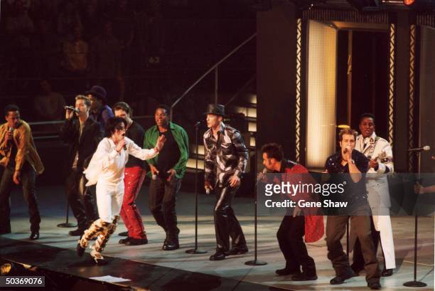 Michael Jackson performing with siblings , formerly known asThe Jackson 5 and members of NSYNC , at Michael Jackson's 30th anniversary concert.