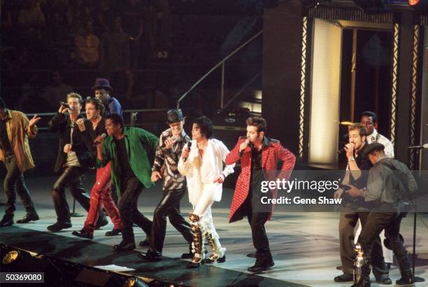 Michael Jackson performing with siblings , formerly known asThe Jackson 5 and members of NSYNC , at Michael Jackson's 30th anniversary concert.