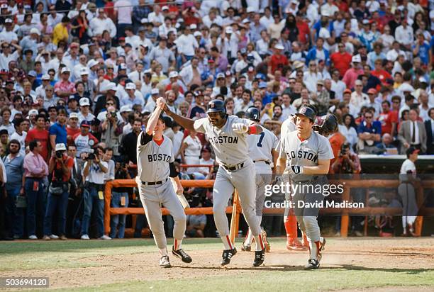 Dave Henderson of the Boston Red Sox celebrates after hitting a home run in the ninth inning of Game 5 of the 1986 ALCS against the California Angels...