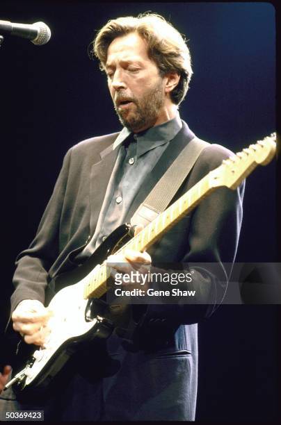 Singer/guitarist Eric Clapton performing on stage.