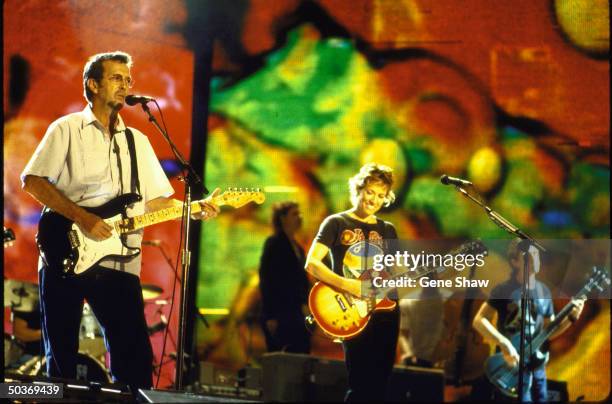 Musicians Eric Clapton & Sheryl Crow performing on stage at Central Park.