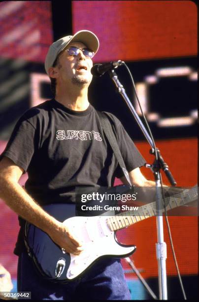 Guitarist/singer Eric Clapton performing on stage in Central Park.