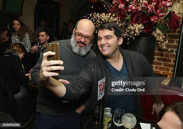 Comedian, actor David Cross from Todd Margaret takes selfies with guests during an Evening Of Pub Quiz Trivia hosted by Entertainment Weekly & IFC at...