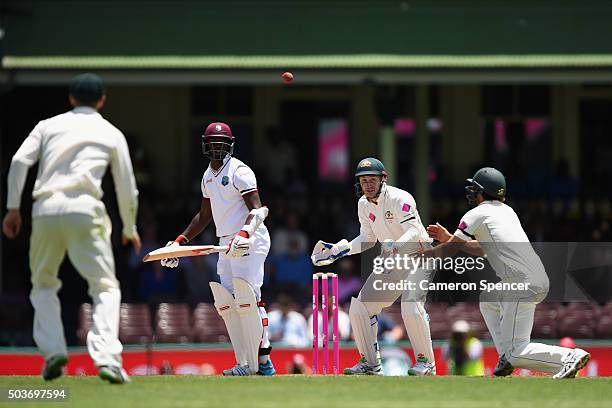 Joe Burns of Australia catches Kemar Roach of West Indies off a delivery by team mate Nathan Lyon of Australia during day five of the third Test...