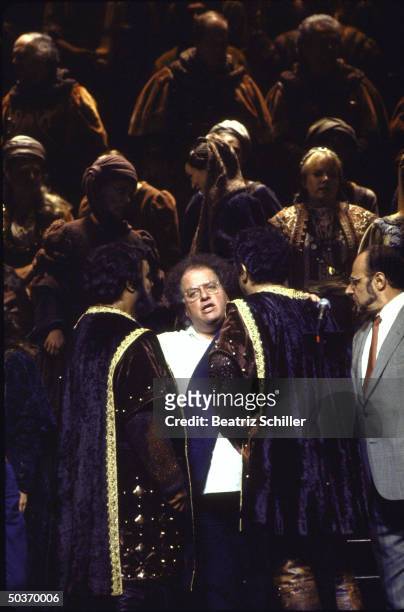Tenors Luciano Pavarotti & Placido Domingo, both in costume for the role of Manrico in Il Trovatore being congratulated by conductor James Levine &...