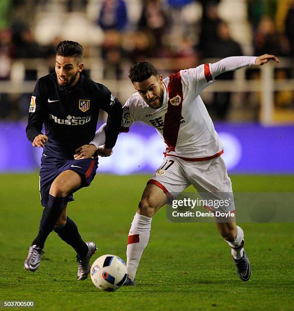 Guilherme Siqueira of Club Atletico de Madrid battles for the ball against Quini Marin of Rayo Vallecano de Madrid during the Copa del Rey, Round of...