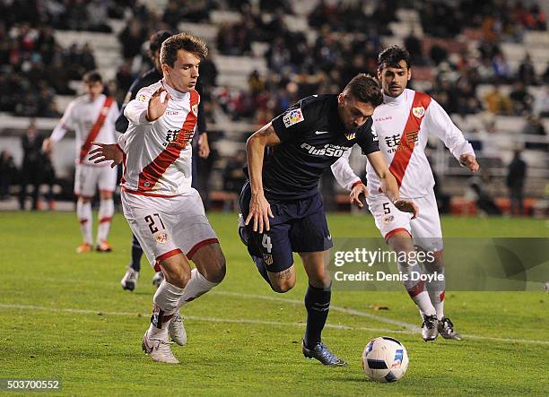 Guilherme Siqueira of Club Atletico de Madrid tries to beat Diego Llorente of Rayo Vallecano de Madrid during the Copa del Rey, Round of 16 First Leg...