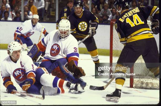 Playoffs. NY Islanders Billy Smith in action, making save vs Boston Bruins.