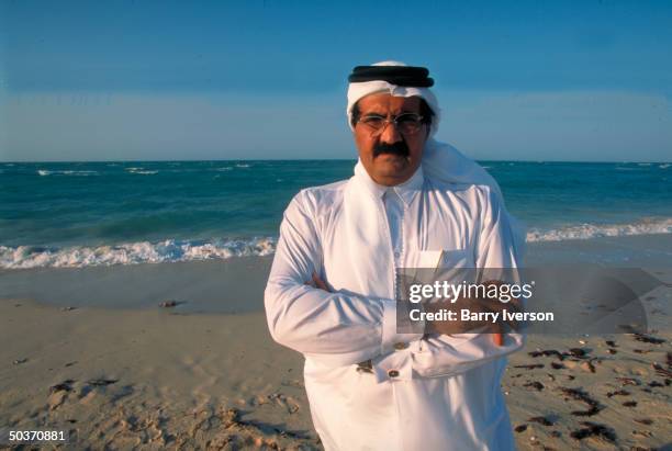 Emir Sheikh Hamad bin Khalifa al-Thani enjoying leisure time on beach .