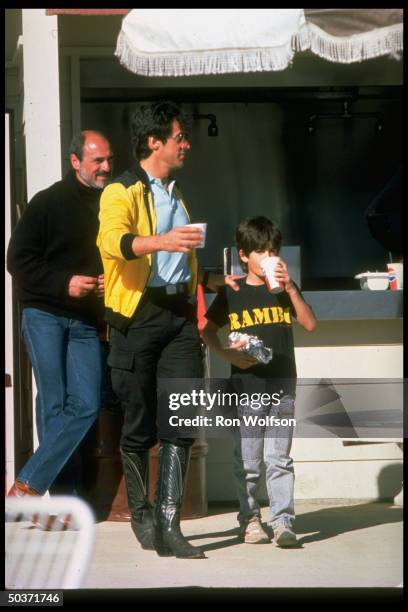Actor Sylvester Stallone w. Son Sage outside.