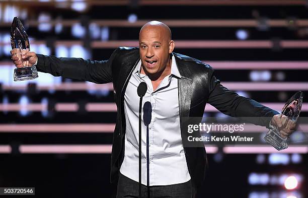 Actor Vin Diesel accepts the Favorite Movie and Favorite Action Movie awards for 'Furious 7' onstage during the People's Choice Awards 2016 at...