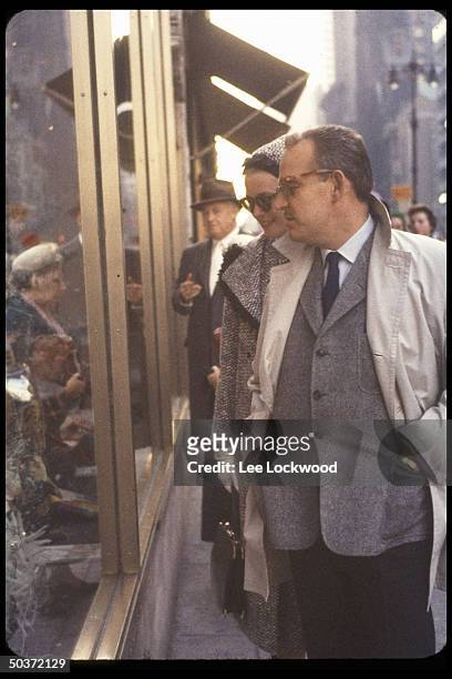 Prince Rainier and Princess Grace of Monaco, formerly actress Grace Kelly, window-shopping.