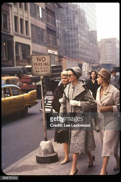 Princess Grace of Monaco , formerly actress Grace Kelly, strolls along street with mother, Mrs. John B. Kelly .