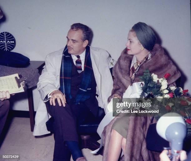 Prince Rainier and Princess Grace of Monaco, formerly actress Grace Kelly, appearing at airport press conference.