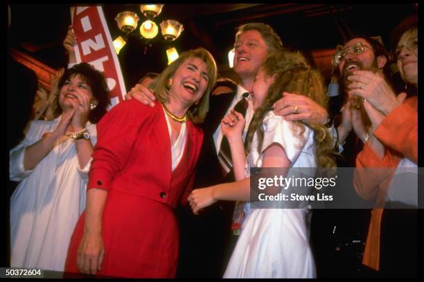 Pres-nominee Bill Clinton in familial embrace w. Wiife Hillary Rodham Clinton & daughter Chelsea on floor of Democratic Natl. Convention.