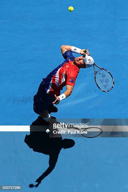 Lleyton Hewitt of Australia Gold serves to Alexandr Dolgopolov of the Ukraine in the mens singles match during day five of the 2016 Hopman Cup at...