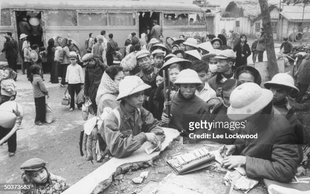 Vietnamese children returning to Hanoi during pause in bombing raids.