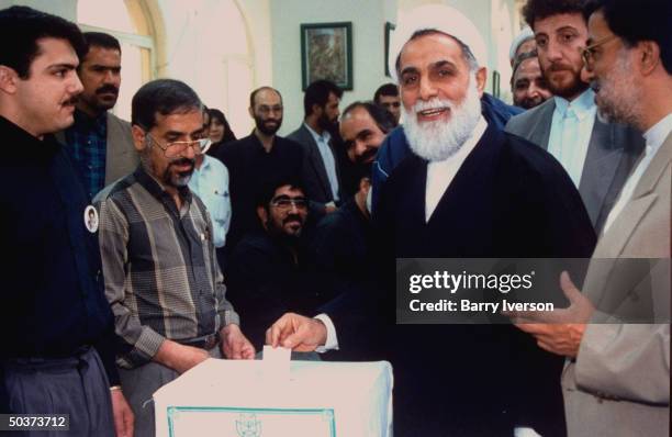 Iranian parliament speaker Ali Akbar Nateq-Noori, conservative cleric presidential candidate favored by establishment, casting his vote into ballot...