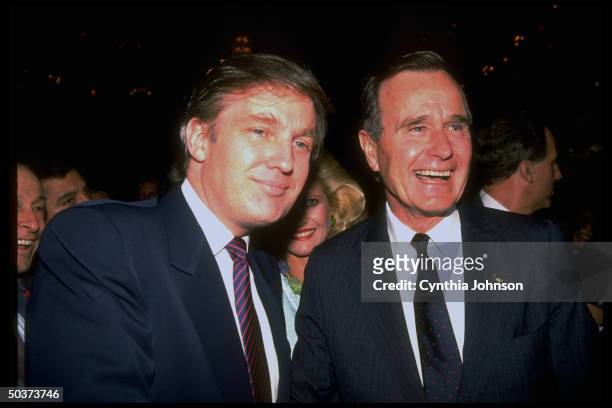 Republican presidential hopeful VP George Bush socializing w. Real estate mogul Donald & Ivana Trump during campaign event at Waldorf Astoria.